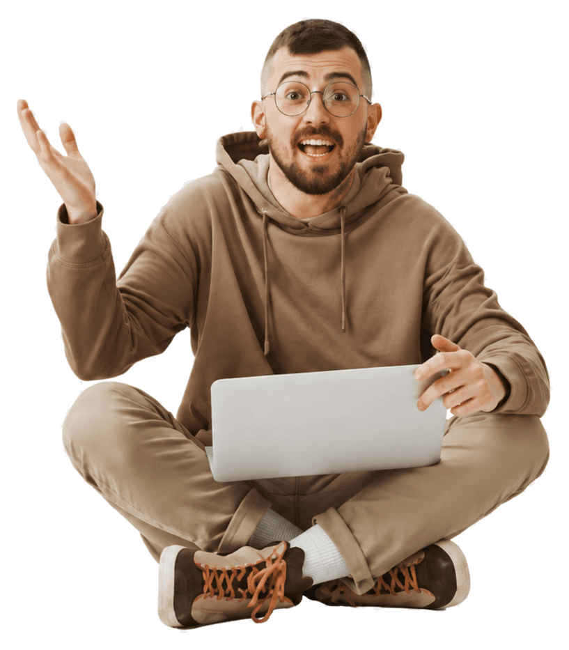 SEO specialist sitting cross-legged with a laptop